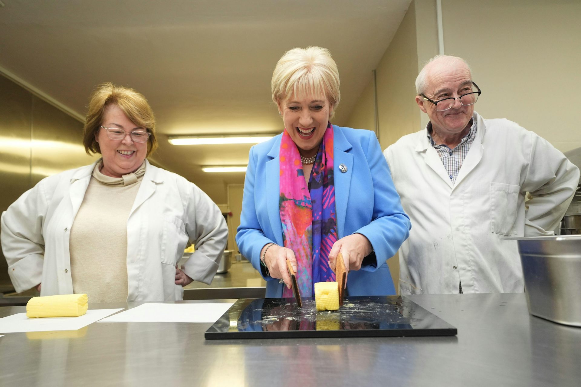 Heather Humphries making butter in a factory.