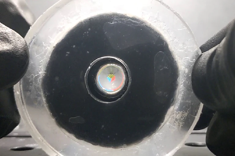 a rubbery disk held between two hands