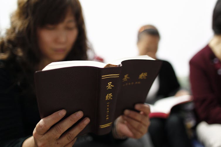 A Chinese Christian reading the Bible.