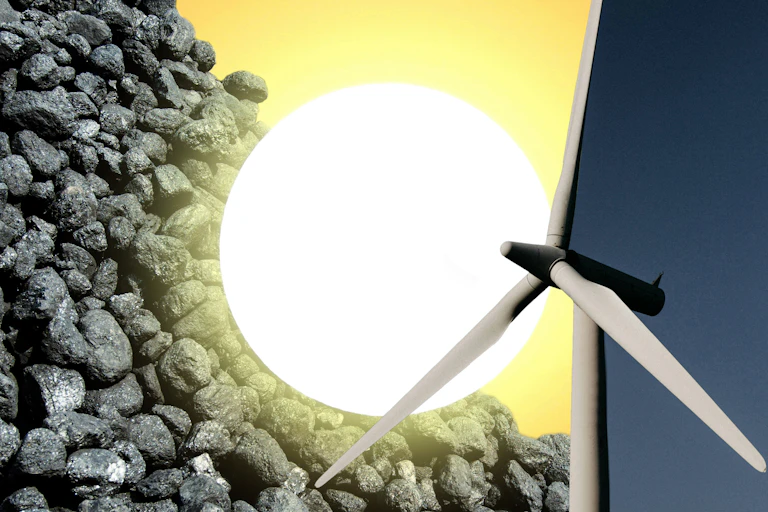 A pile of coal, the sun and a wind turbine