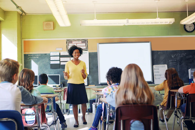 Teacher at front of classroom