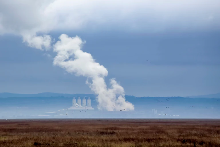 Smoke bellowing from a distant power station.