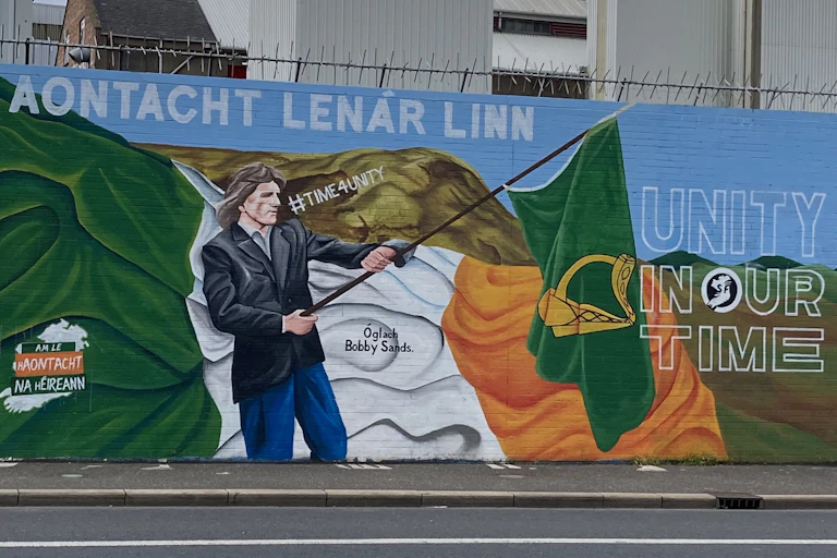 A mural showing the Irish flag being waved