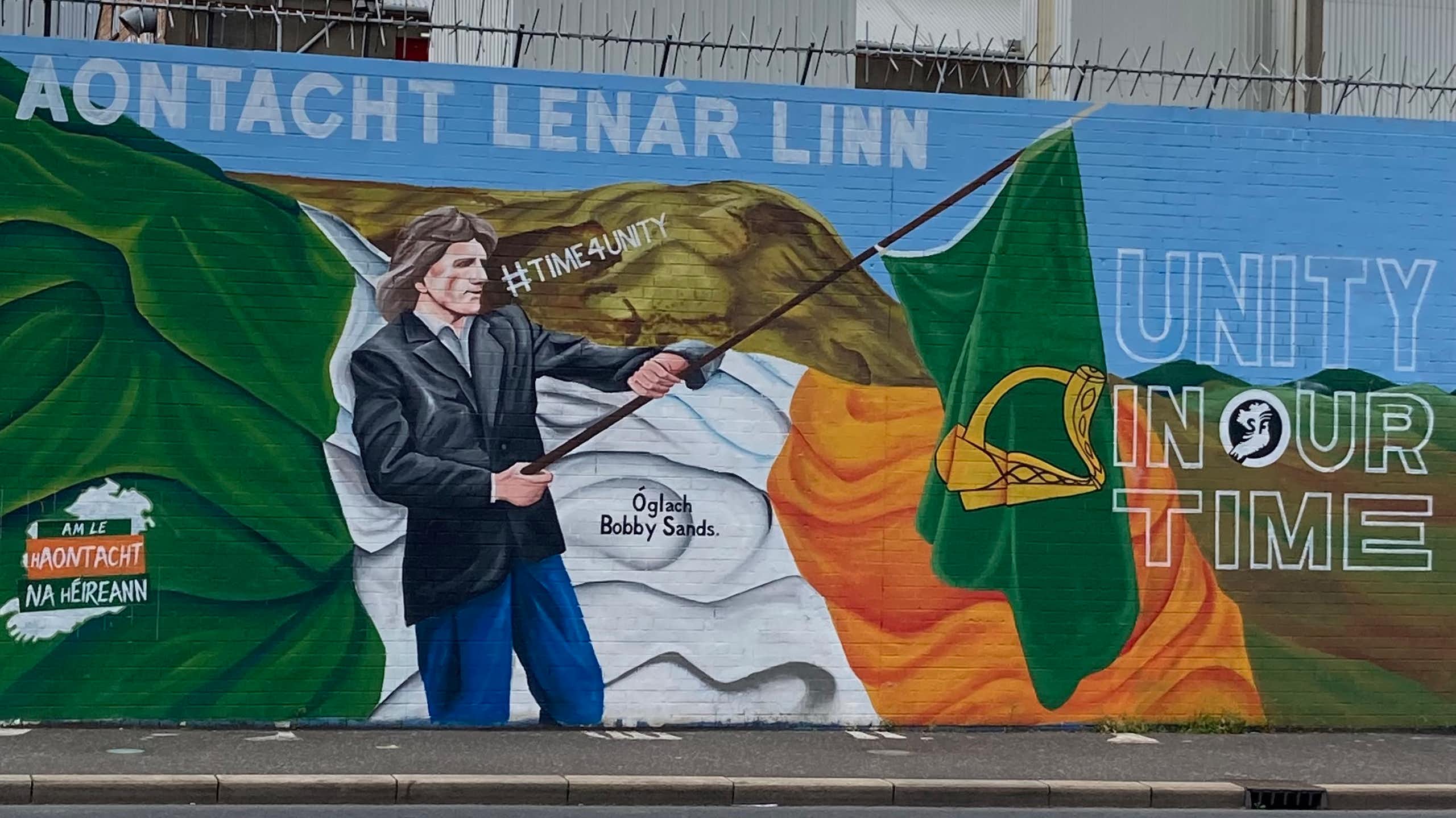 A mural showing the Irish flag being waved
