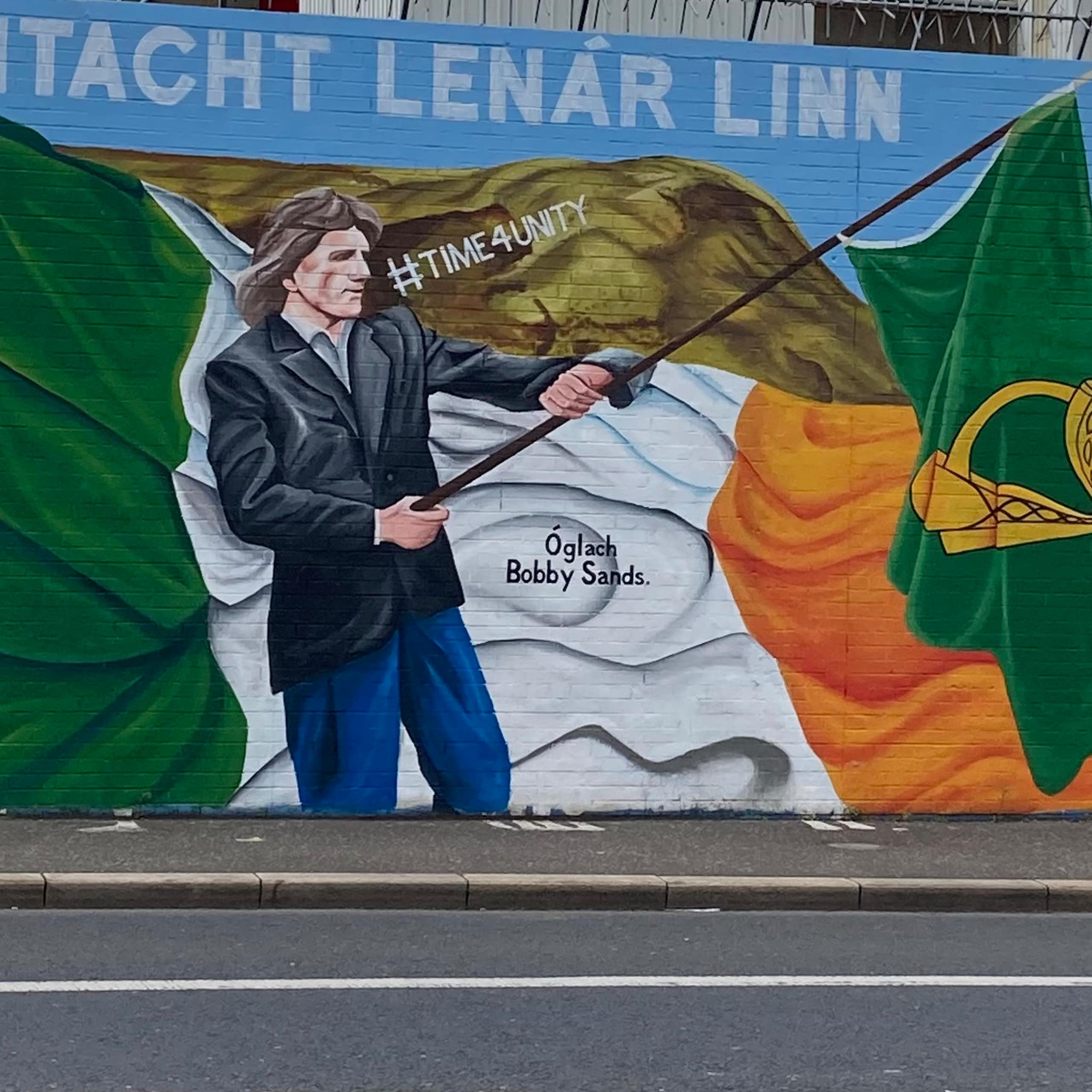 A mural showing the Irish flag being waved