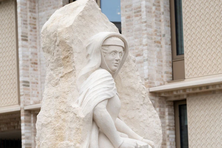A statue of a medieval woman