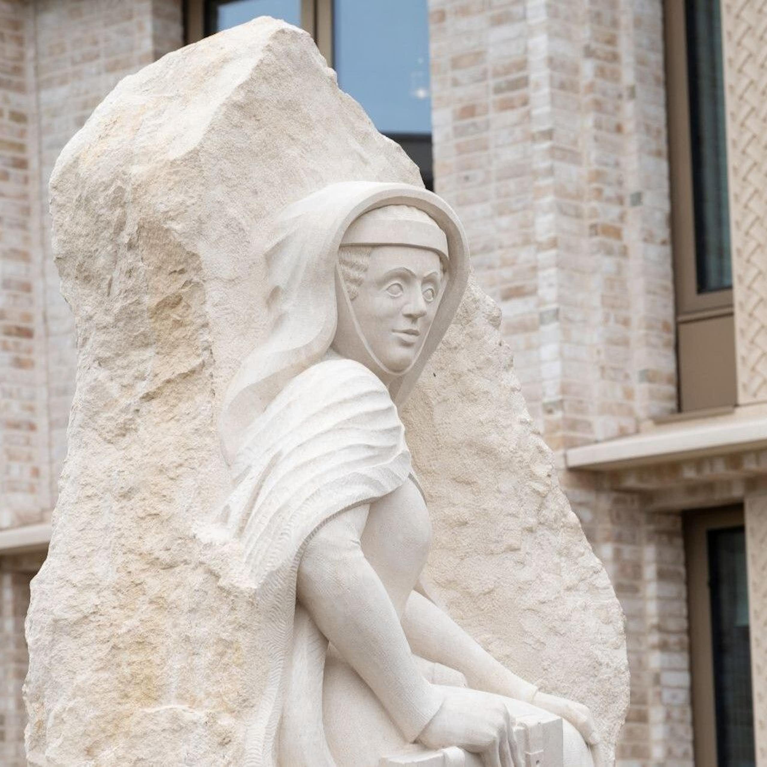 A statue of a medieval woman