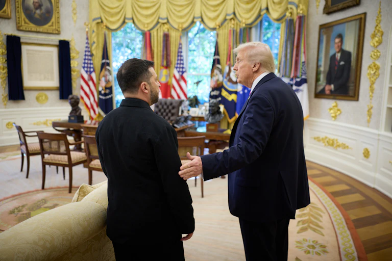 Volodymyr Zelensky and Donald Trump stand in the Oval office, October 23 2025.