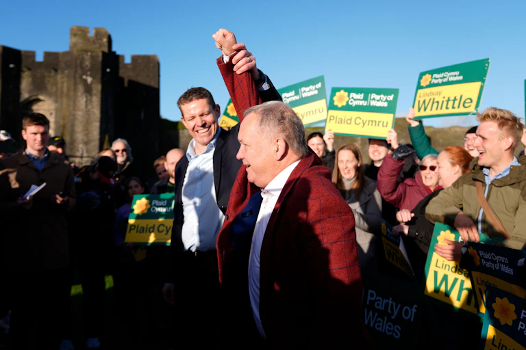 Rhun ap Iorwerth and Lindsay Whittle with Plaid Cymru supporters at Caerphilly castle.