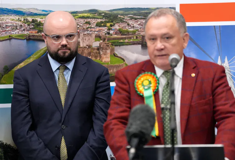 Llyr Powell standing behind Lindsay Whittle