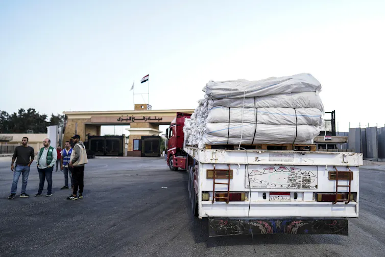 A humanitarian aid truck moves through the Rafah border crossing towards Gaza.
