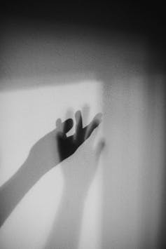 Two slightly transparent, disembodied hands.