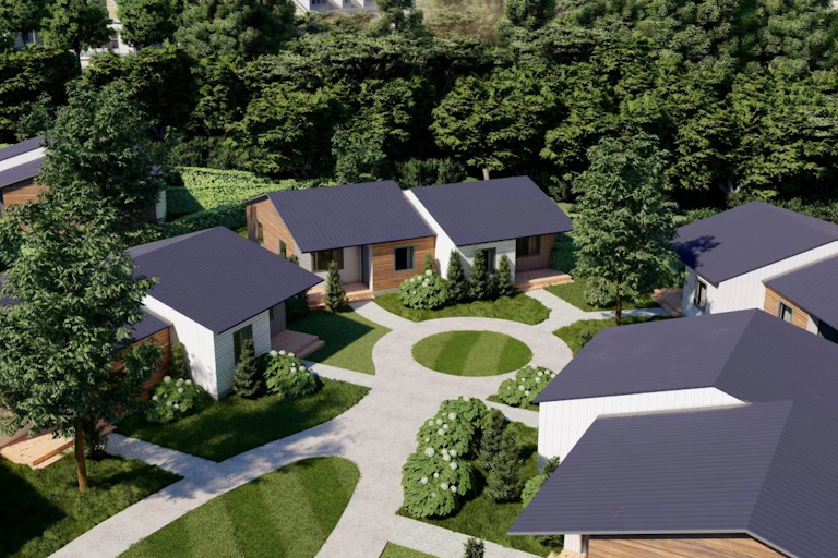 A rendering of small homes surrounded by trees.