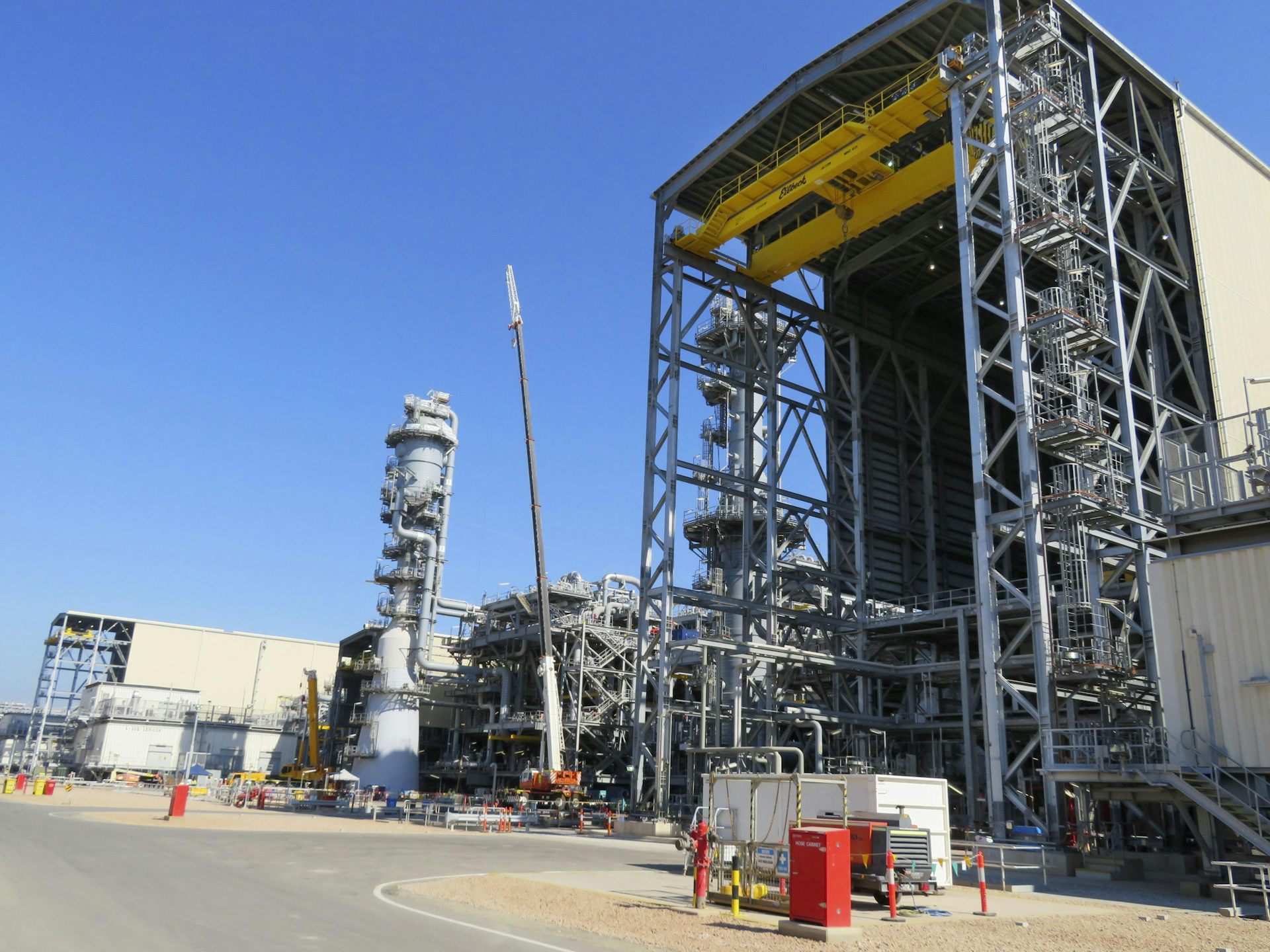 An industrial gas plant, with a blue sky in the background