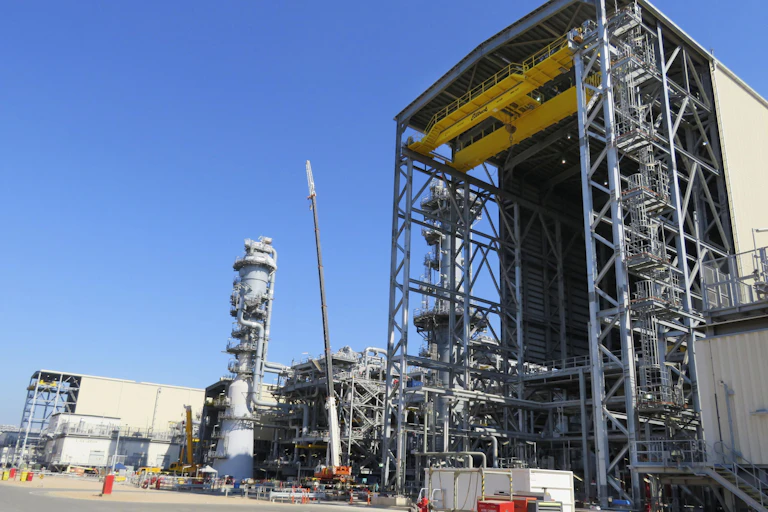 An industrial gas plant, with a blue sky in the background