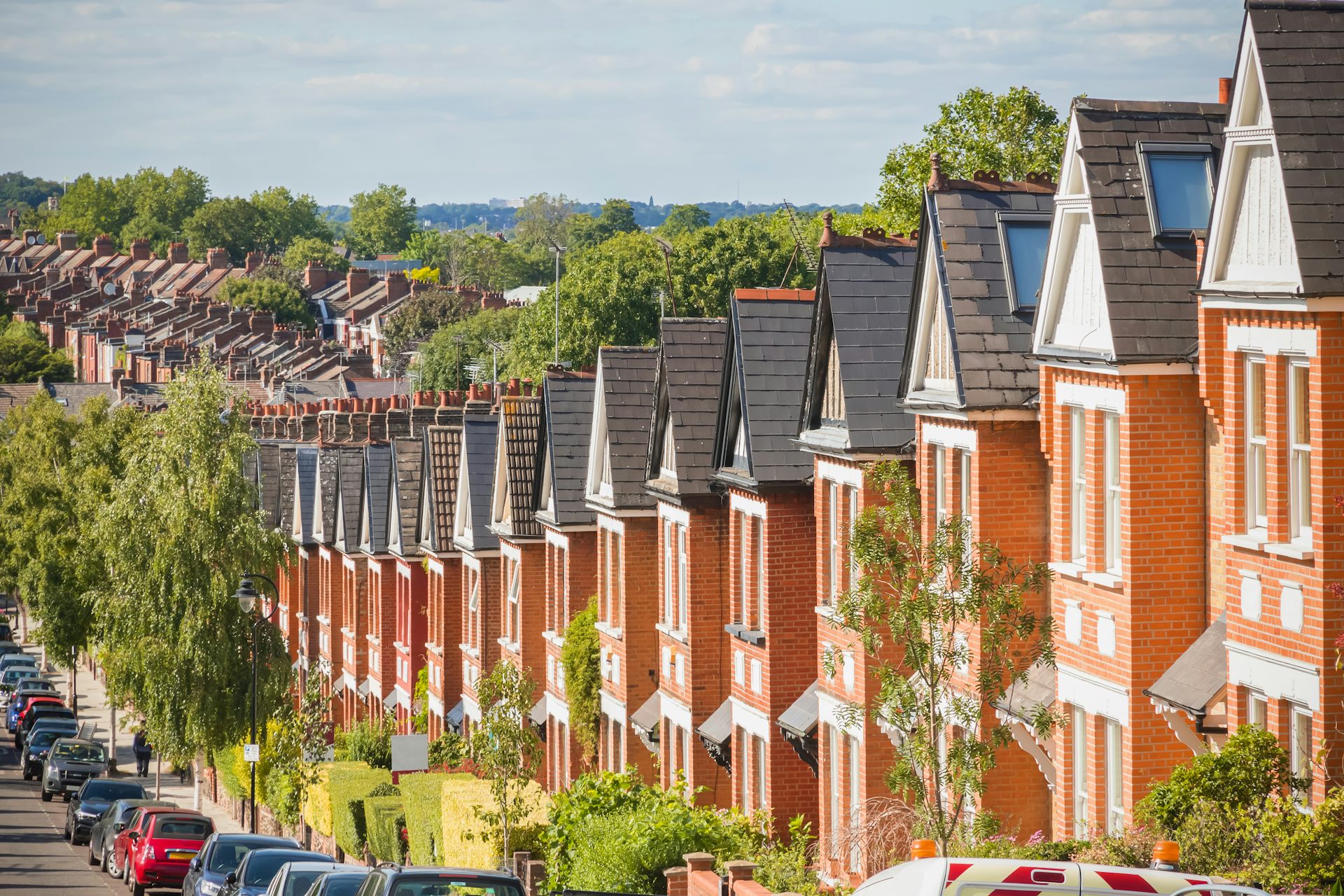 Row of identical English terraced houses