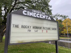A marquee sign says 'The Rocky Horror Picture Show'