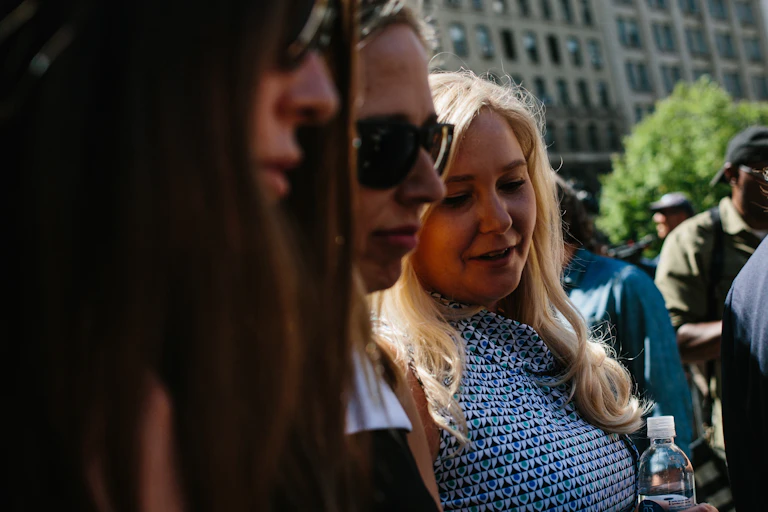 Virginia Giuffre (right) and other survivors of Jeffrey Epstein's abuse after a court hearing in 2019.