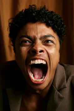 A man screaming from fear.