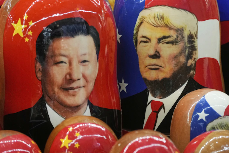 The inmage of two men is seen on Russian dolls
