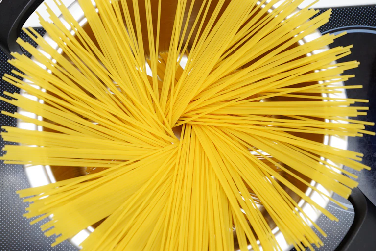 Spaghetti in a cooking pot.