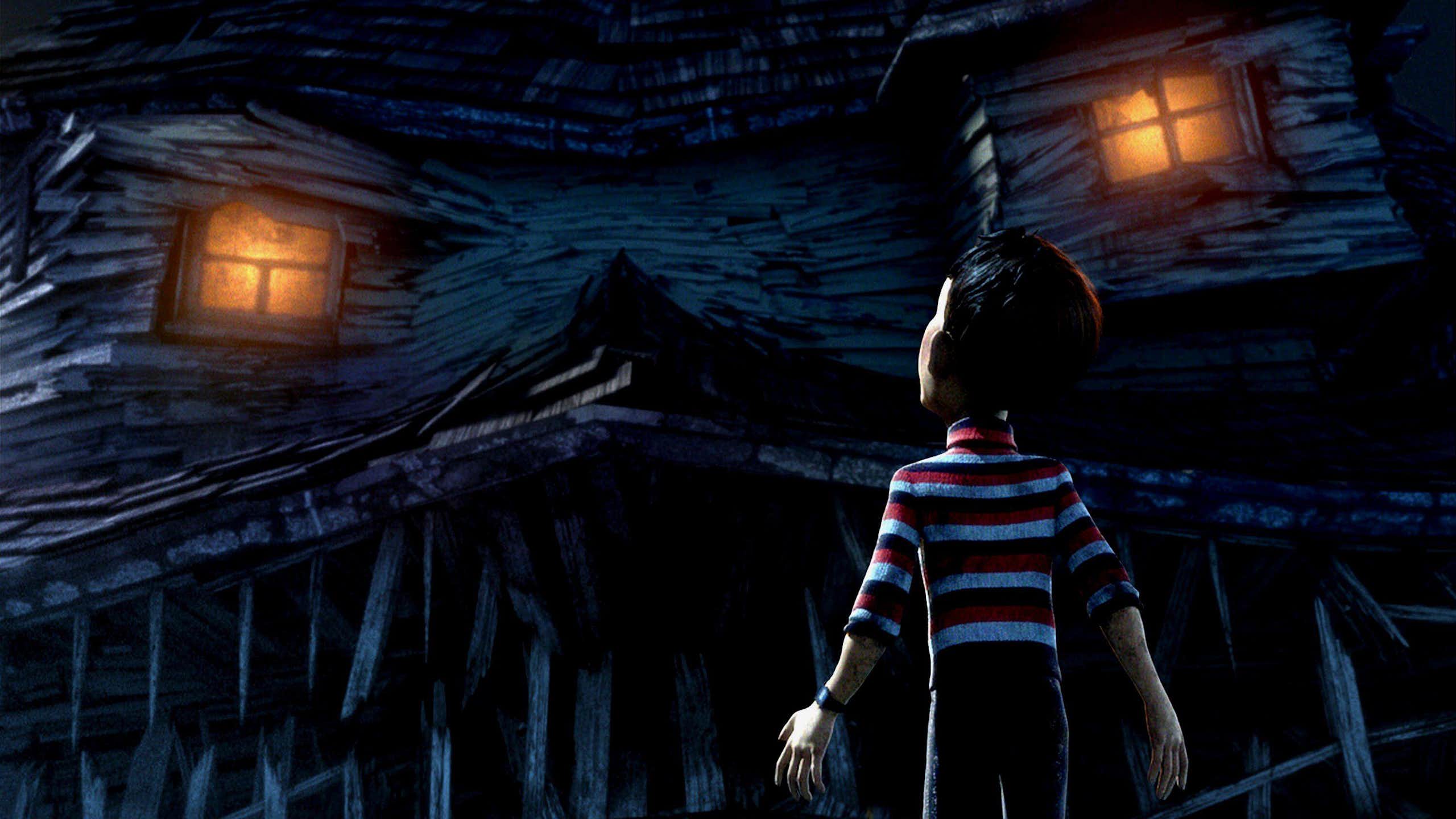 A boy stands in front of a house that has come alive.