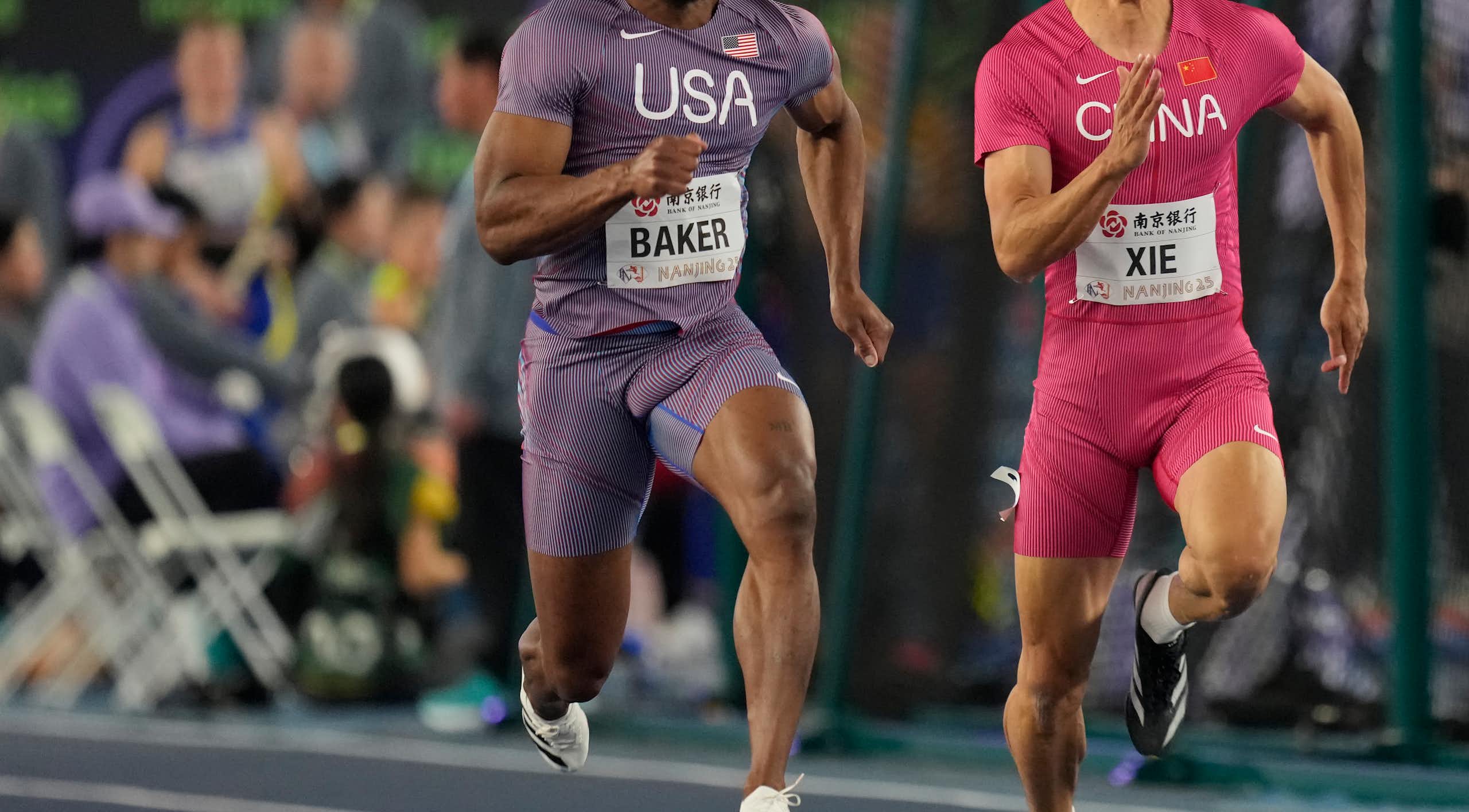 Two sprinters compete on a track.