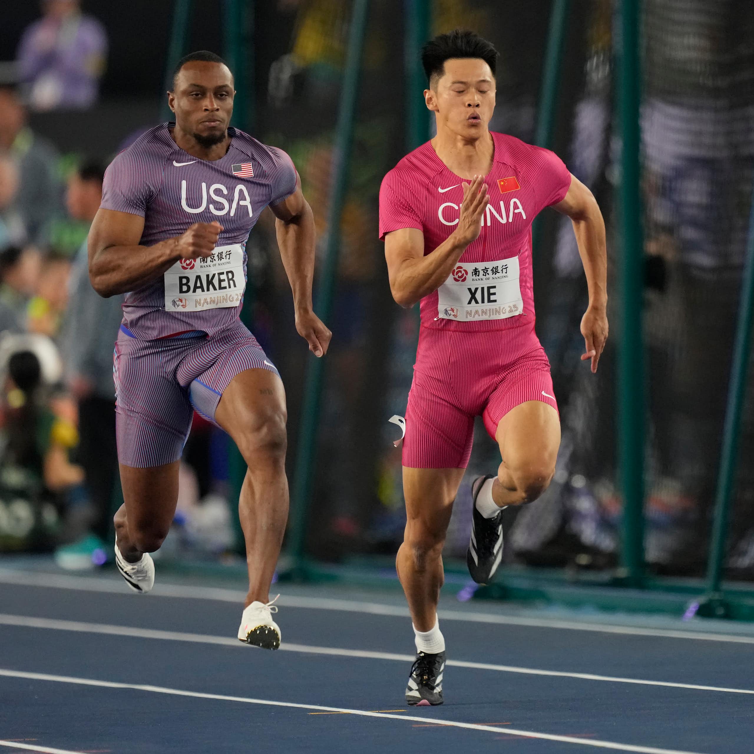 Two sprinters compete on a track.