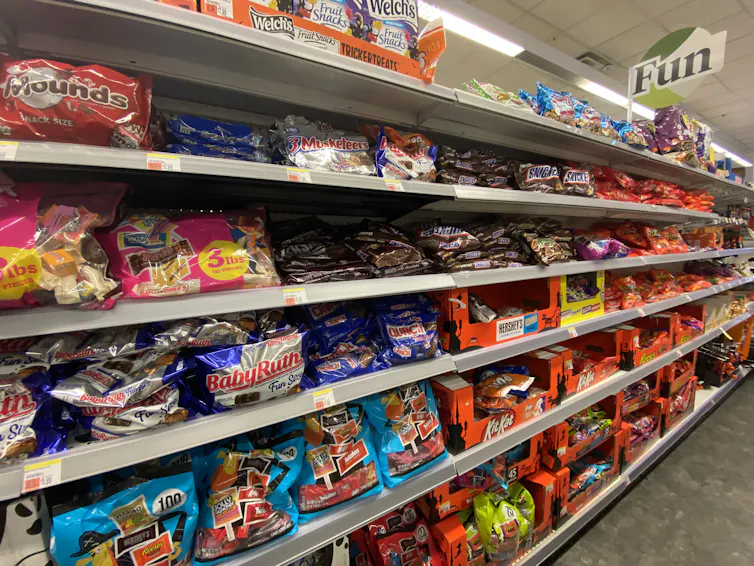 Pharmacy shelves lined with Halloween candy