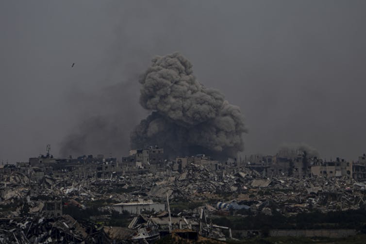 A bomb explodes on a crowded enclave.