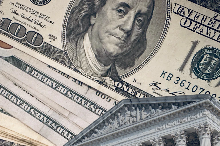A photoillustration juxtaposes the Supreme Court building with hundred-dollar bills.