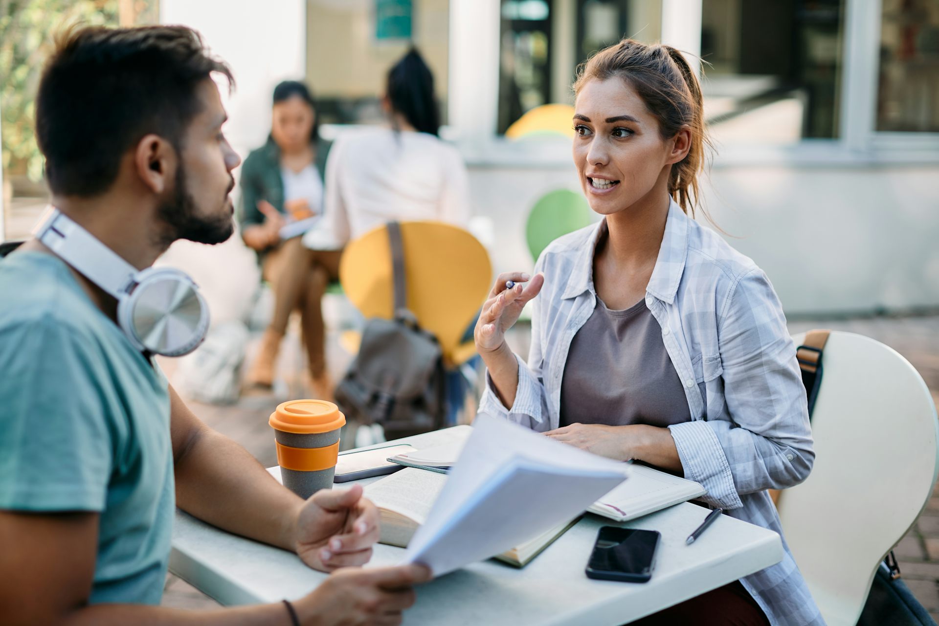 Man and woman talking over coffee