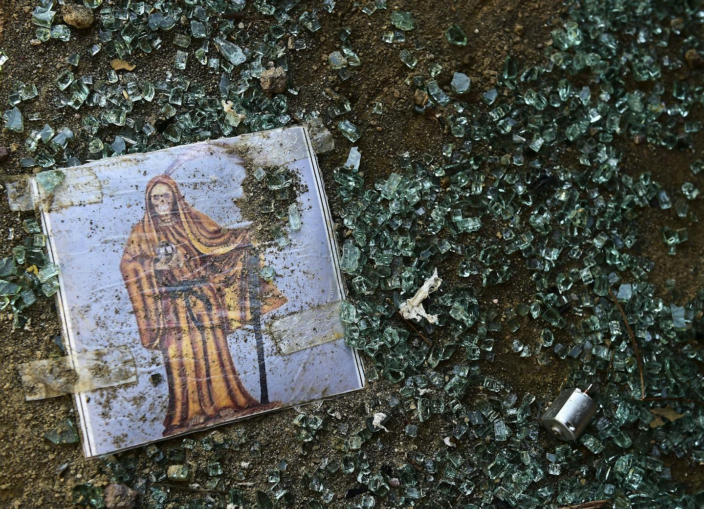 An image amid broken glass.