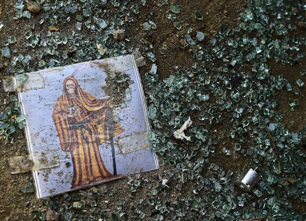 An image amid broken glass.