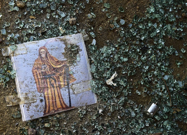 An image amid broken glass.