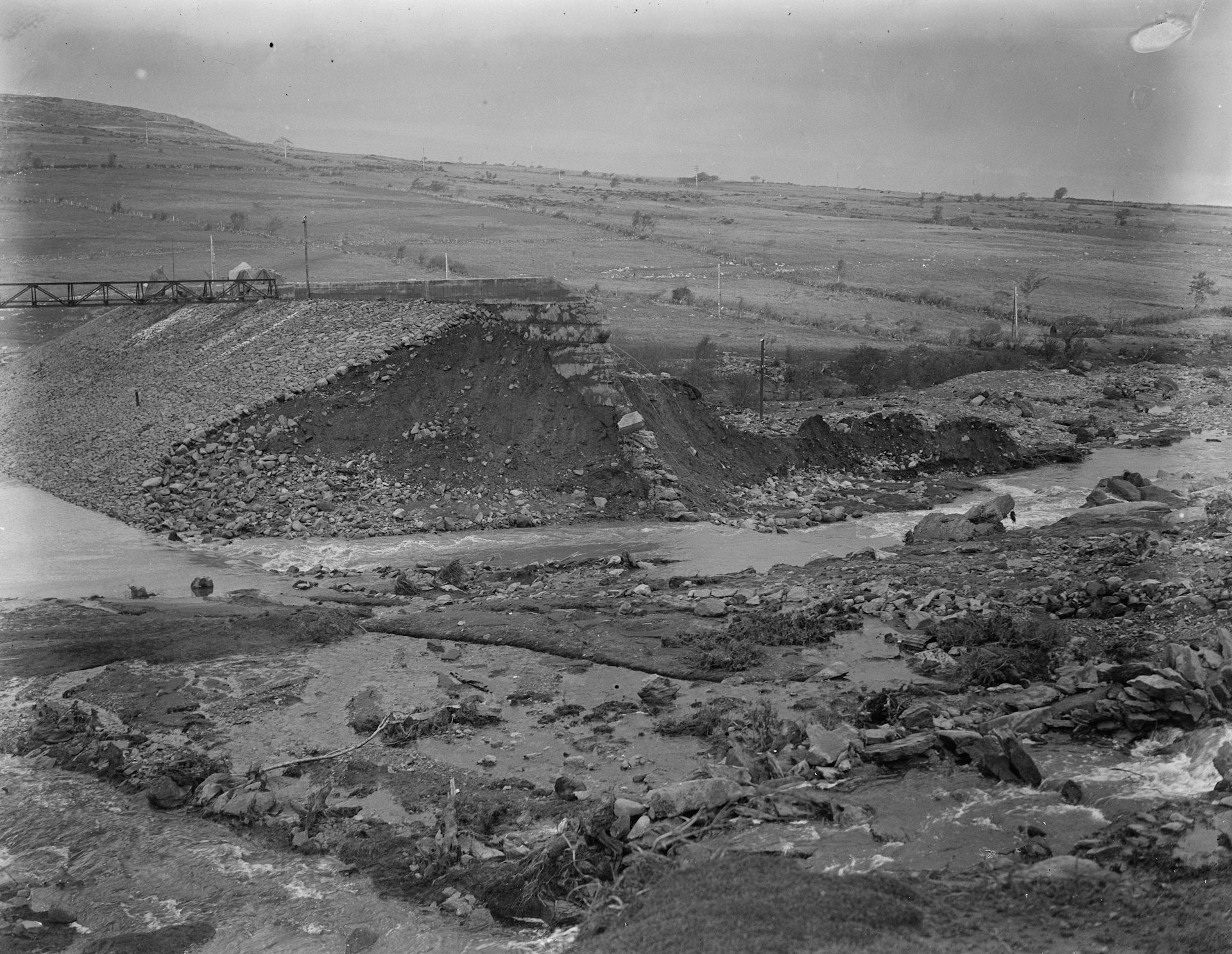 ruined landscape from stony broken dam, black and white pic