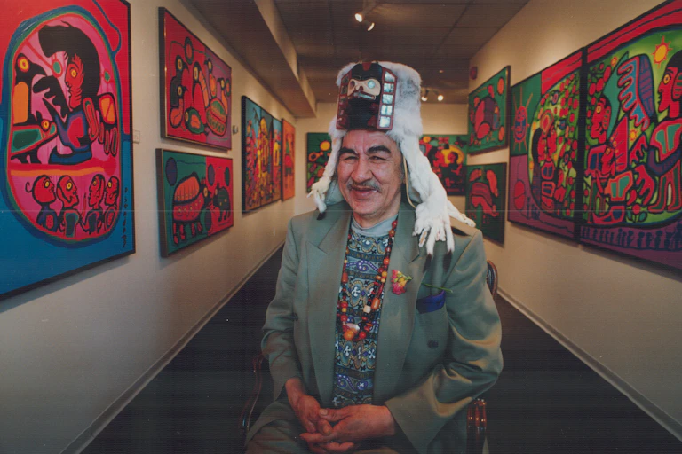 The artist at ease; decked out in a spectacular ermine headdress