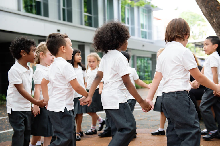 Kids holding hands in a playground