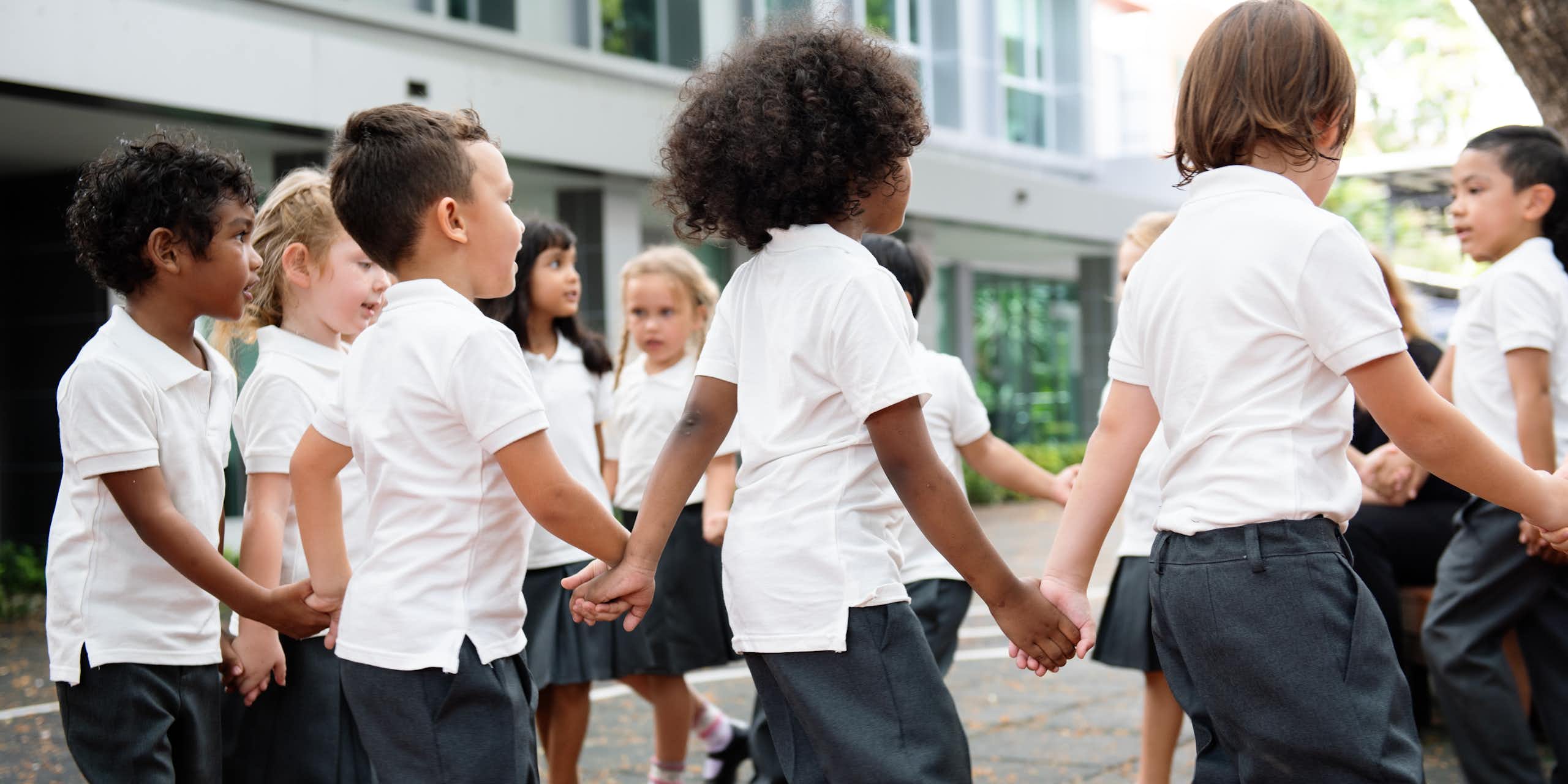 Kids holding hands in a playground