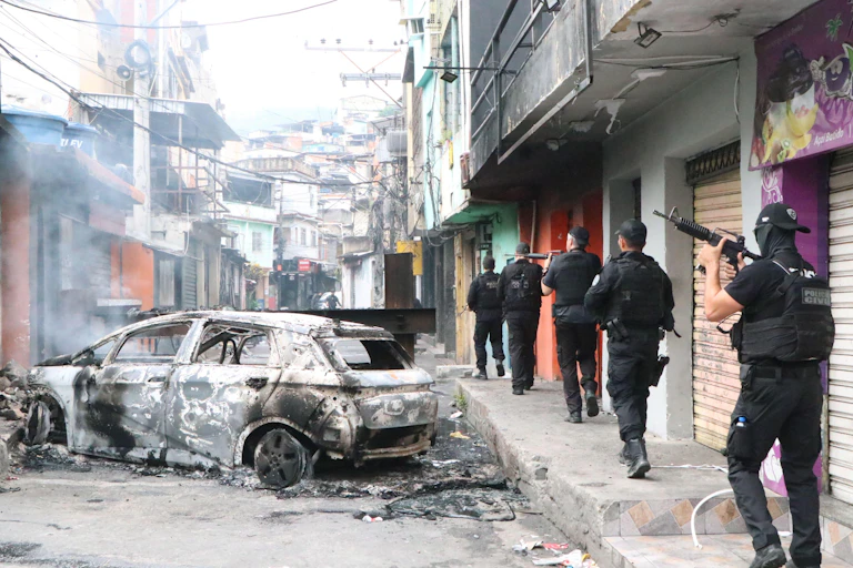 Brazilian armed police patrol the streets of an inner-city favela in Rio de Janeiro.