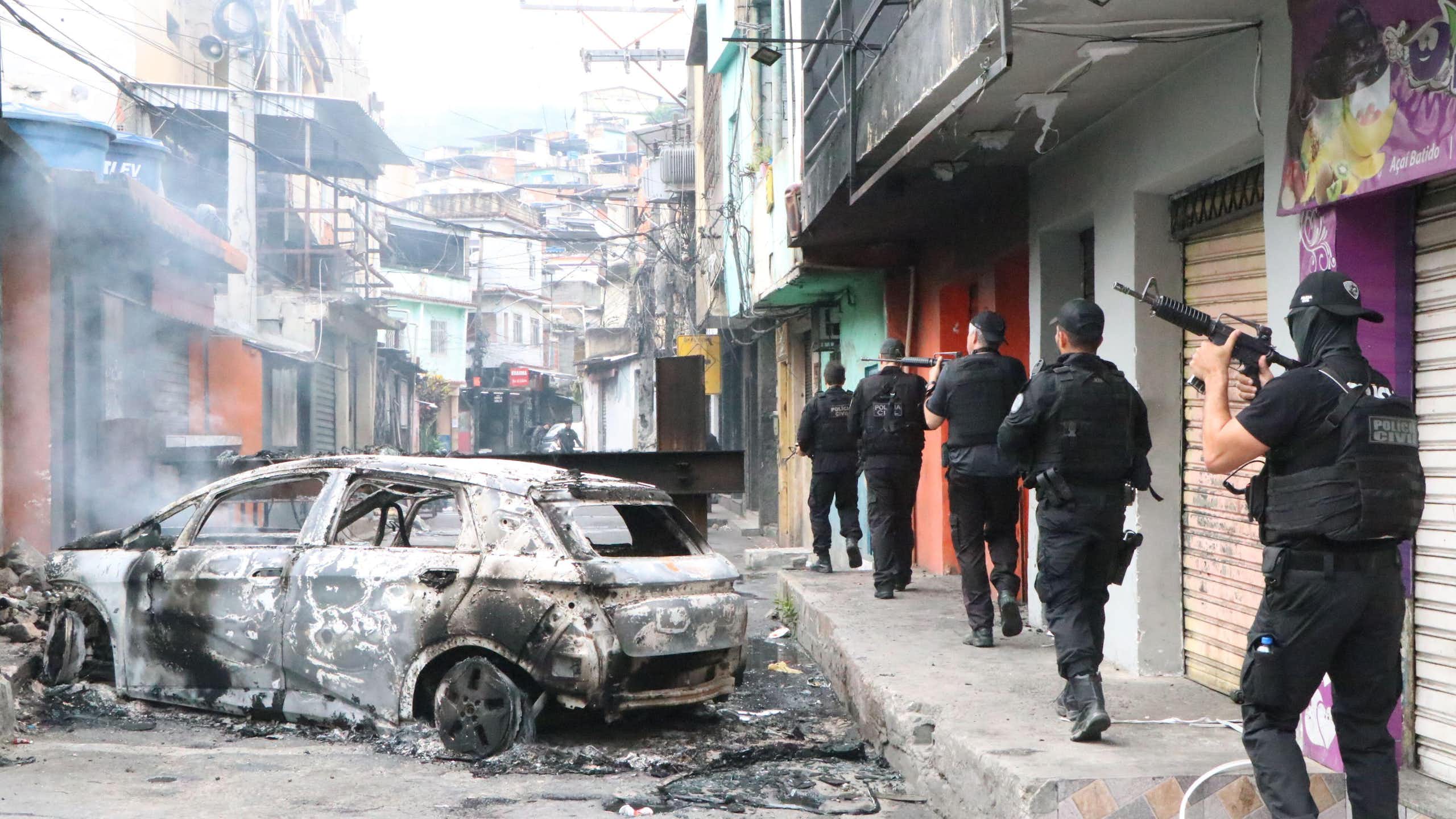Brazilian armed police patrol the streets of an inner-city favela in Rio de Janeiro.