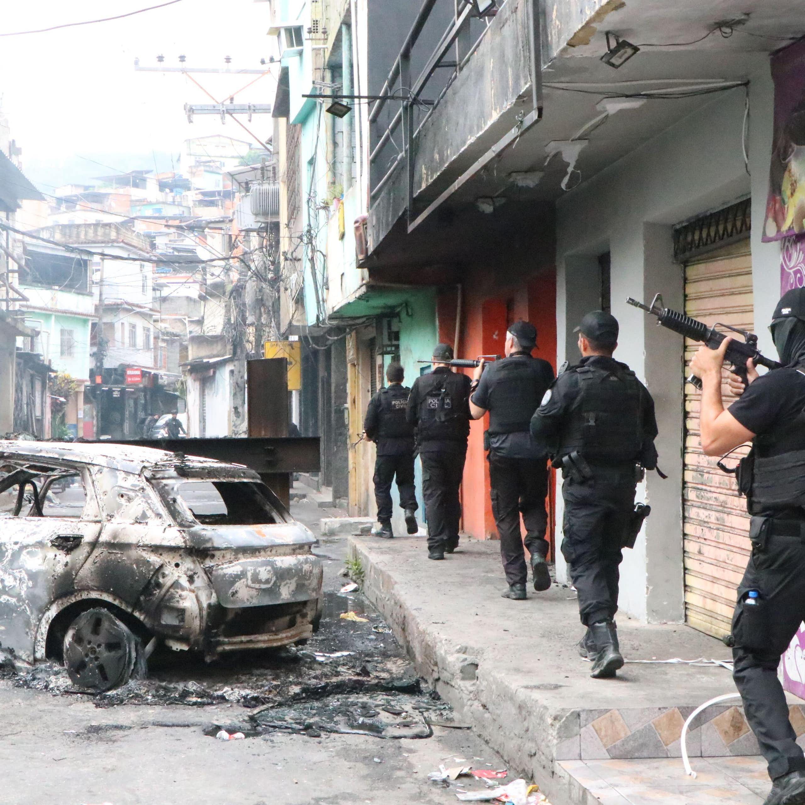 Brazilian armed police patrol the streets of an inner-city favela in Rio de Janeiro.