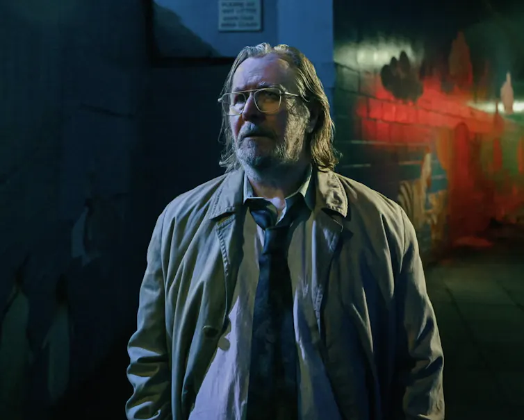 A unkempt man in a dirty mac.