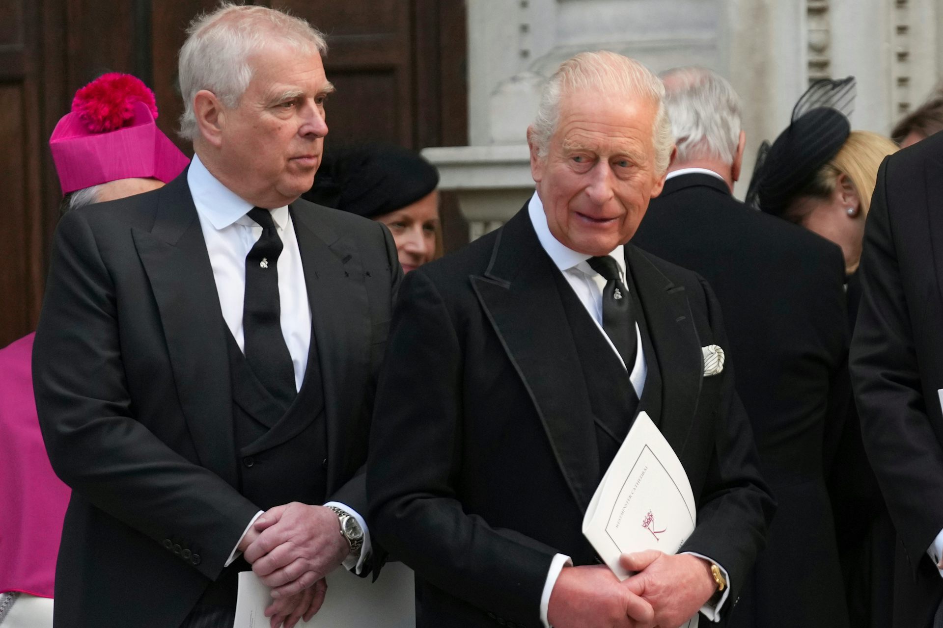 Prince Andrew and King Charles stand side by side.