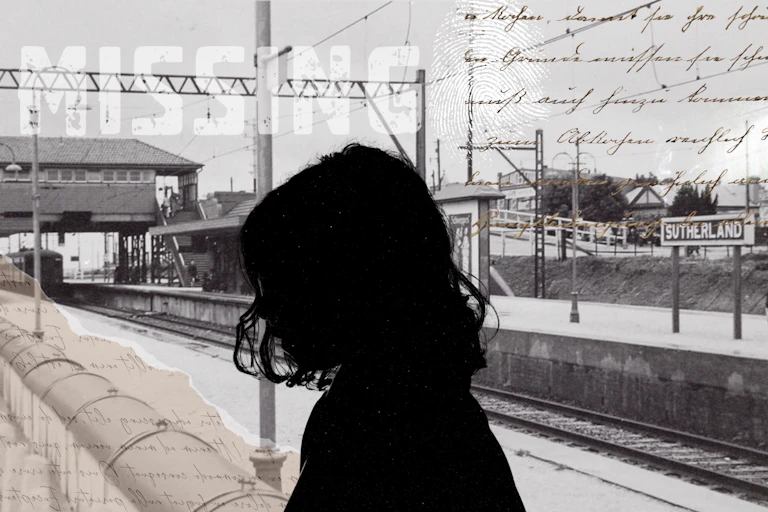 The silhouette of a man in front of a black and white train station