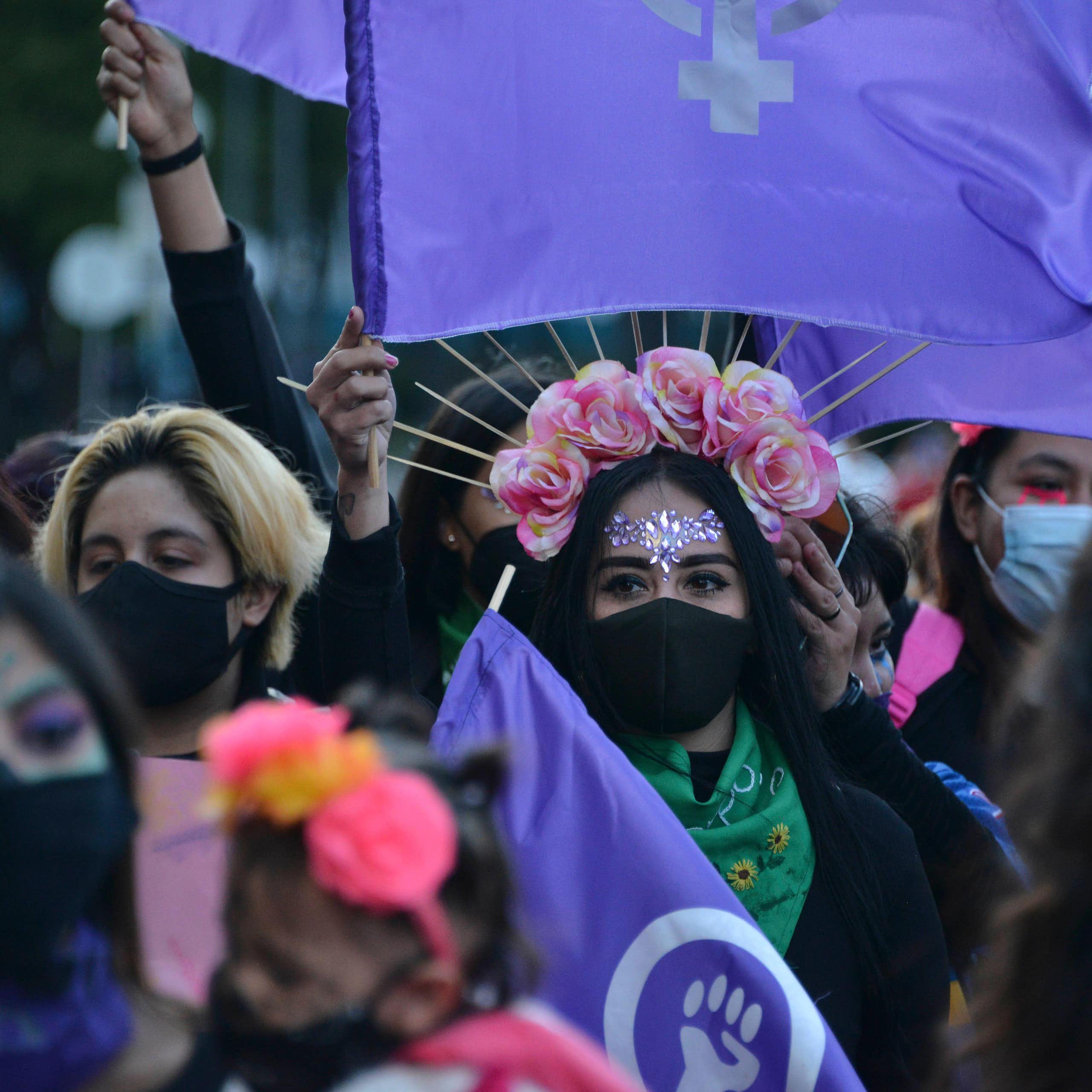 Women dressed in traditional costume for a Day of The Dead protest march.