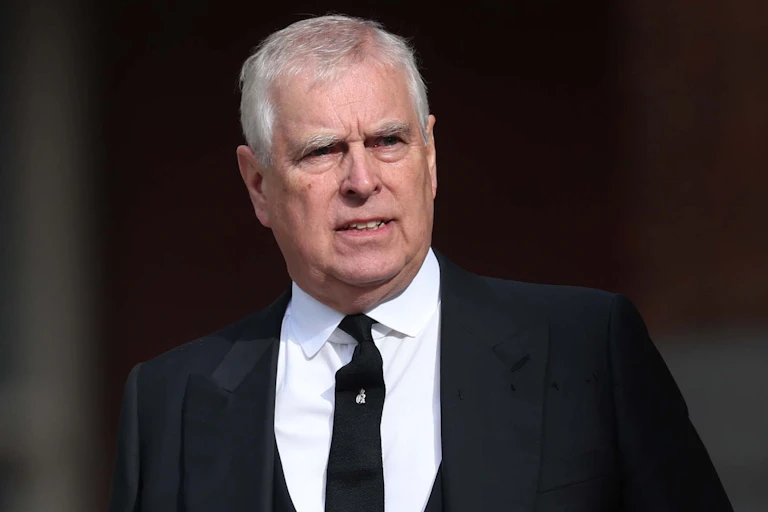 Andrew Mountbatten Windsor in a black suit and tie