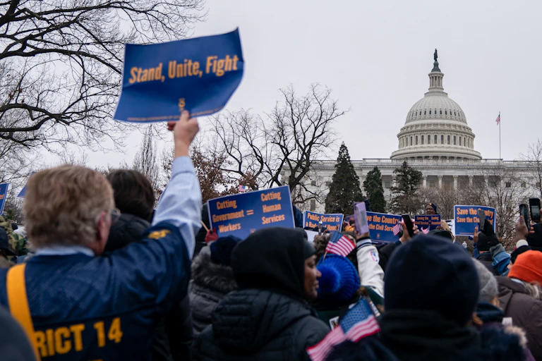 People participate in a protest outside the U.S. Capitol.