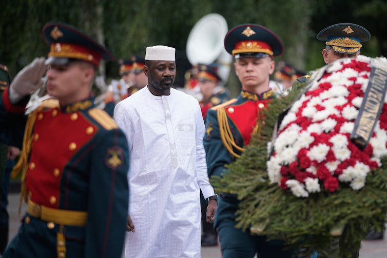 Why an armed workforce connected to al-Qaida is gaining flooring in Mali 1 Mali's military leader, General Assimi Goïta, attends a wreath-laying ceremony in Russia.