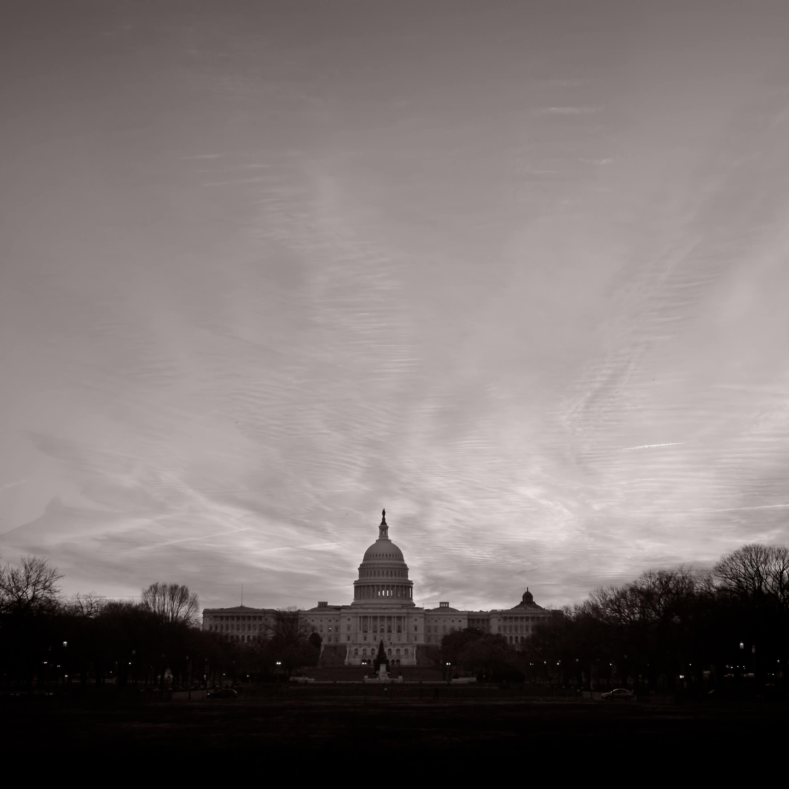 The US Capitol on a dark, gray day.